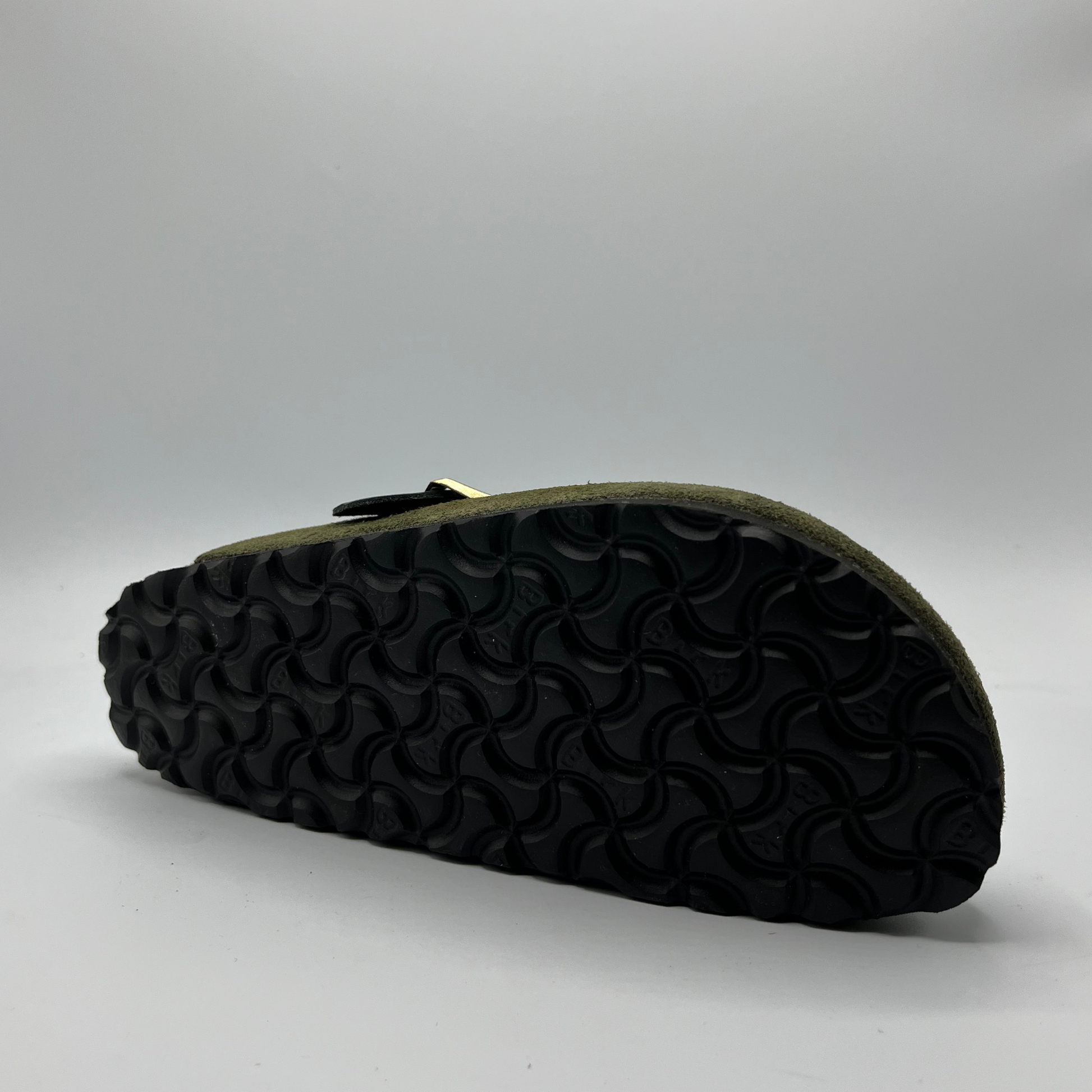 Black sandal sole on a gray background