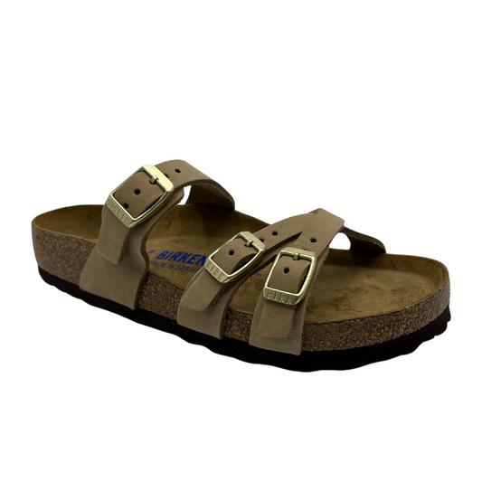 45 degree angled view of taupe strapped sandals with contoured footbed and three straps
