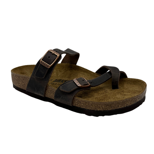 45 degree angled view of oiled leather strapped sandals with two pin buckle straps, suede lined contoured cork footbed