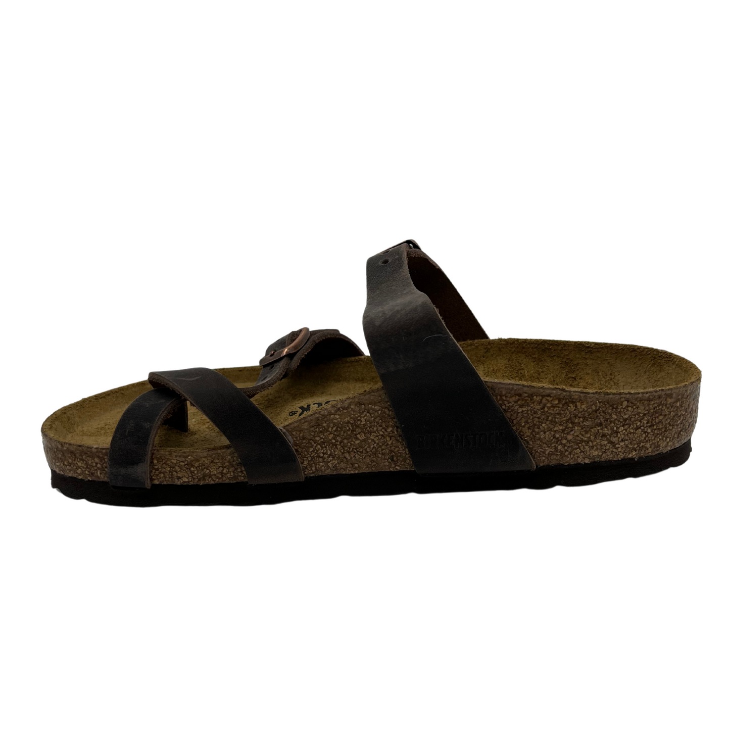 Left facing view of oiled leather strapped sandals with two pin buckle straps, suede lined contoured cork footbed
