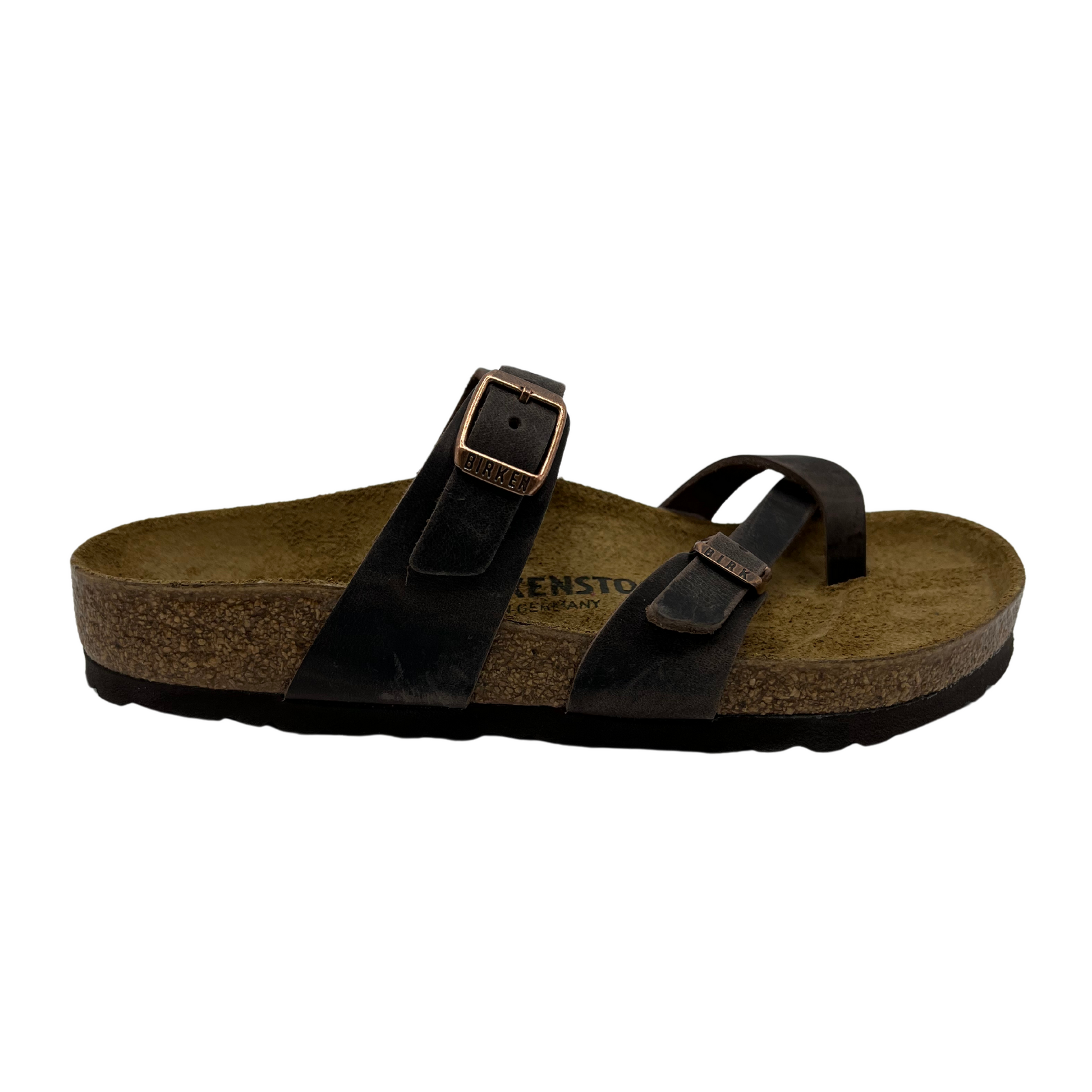 Right facing view of oiled leather strapped sandals with two pin buckle straps, suede lined contoured cork footbed