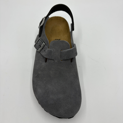 Top view of a charcoal slip on shoe with two adjustable buckle straps on a white background