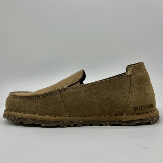 Brown suede loafer shoe on a white background