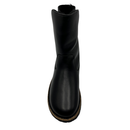 Top view of black leather boot with rubber and cork outsole.