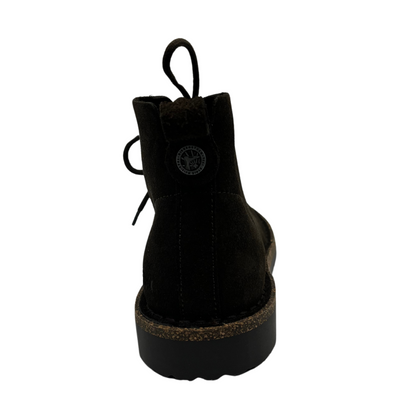 Back view of brown suede short boot with matching laces and rubber and cork outsole