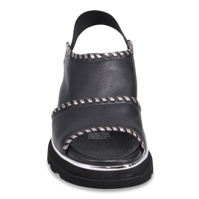 Front of black Django & Juliette Carlenet  sandal with silver studs on a white background