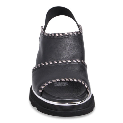 Front of black Django & Juliette Carlenet  sandal with silver studs on a white background