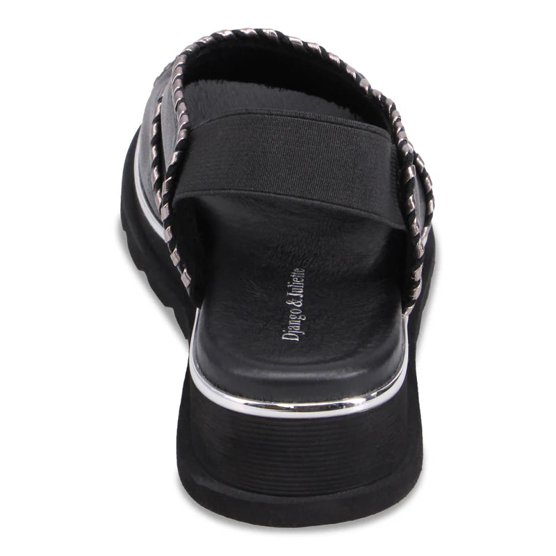 Back of black Django & Juliette Carlenet  sandal with a strap on a white background