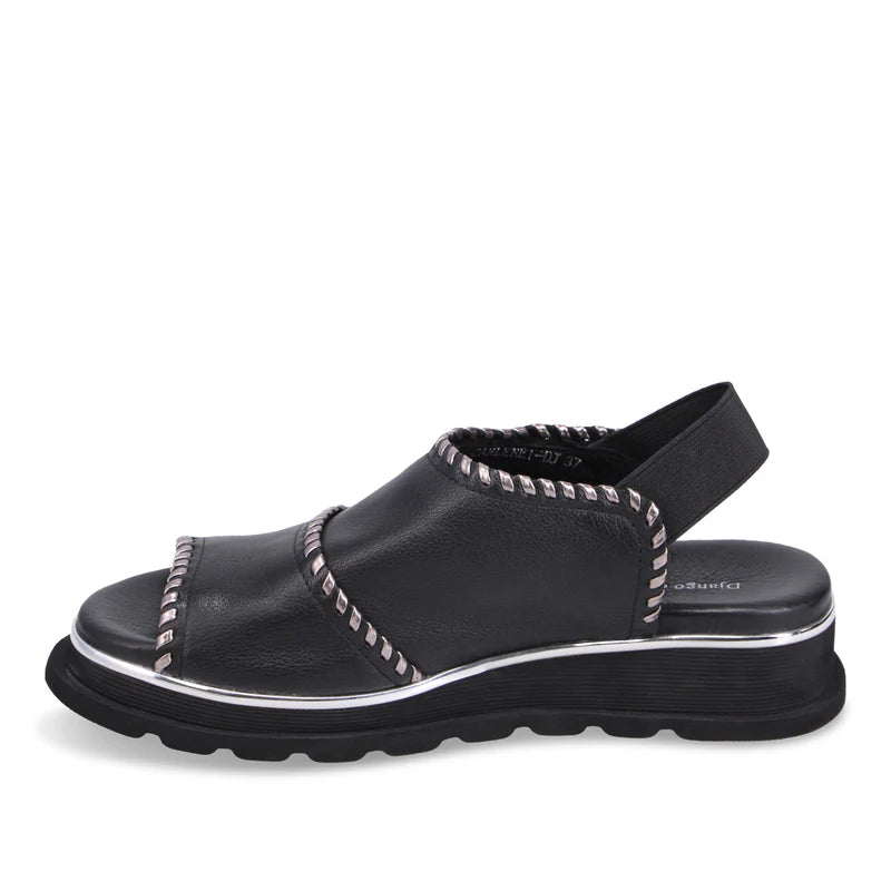 Inner side of Black Django & Juliette Carlenet sandal with metallic accents on a white background