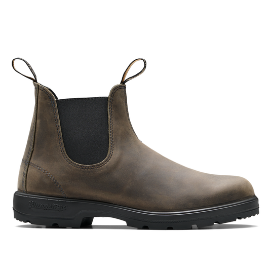 Brown Chelsea boot with black sole on a white background