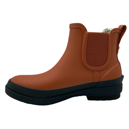 Left facing view of burnt orange short rubber boot with black rubber outsole
