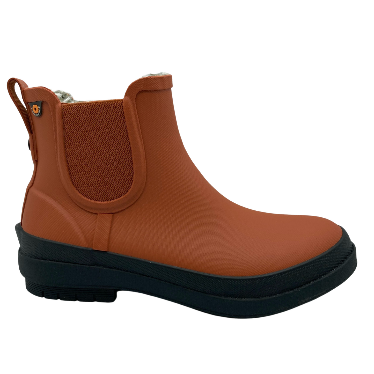 Right facing view of burnt orange short rain boot with elastic side gores and black rubber outsole