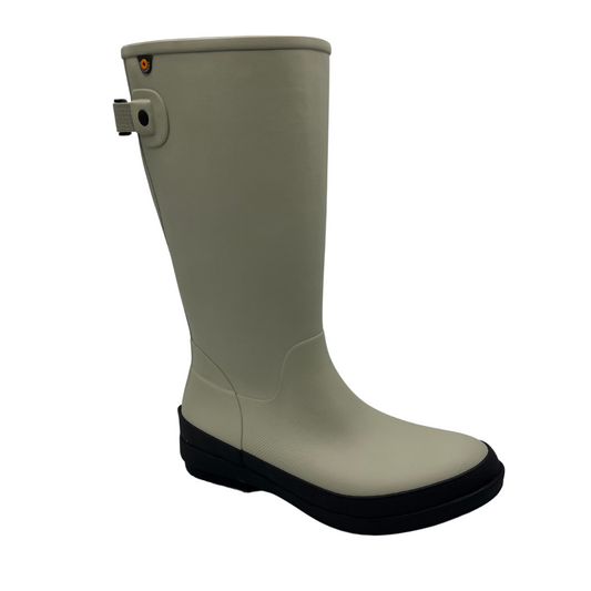 45 degree angled view of oyster coloured rubber boot with adjustable calf strap and black outsole.