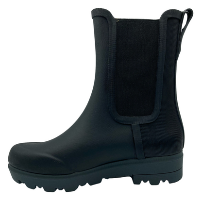 Left facing view of calf height rubber boot with elastic side gores and pull on tab