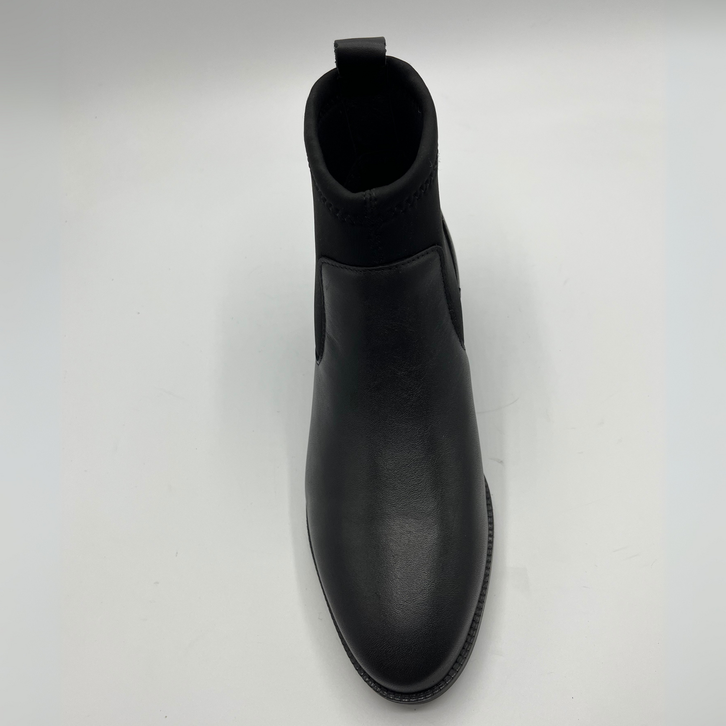 Black Chelsea boot on a white background