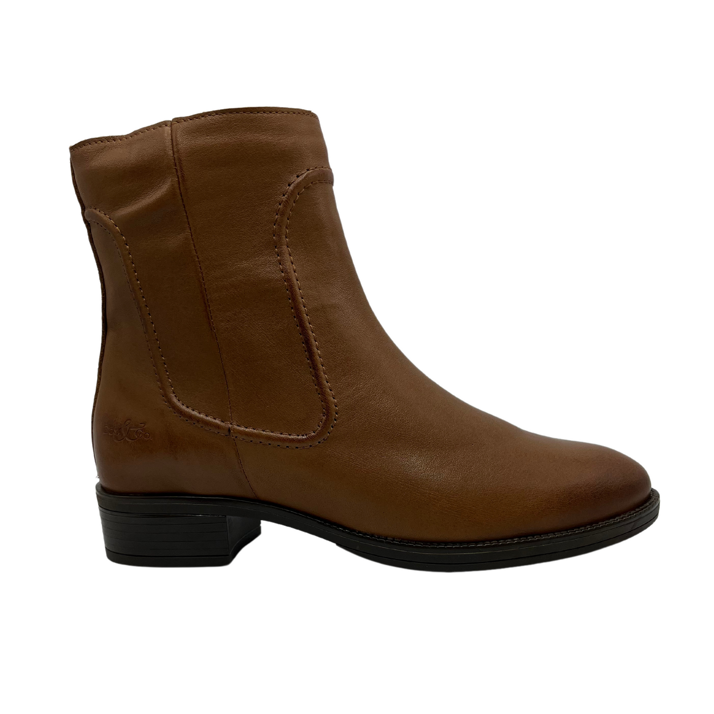 Right facing view of rich tan leather short boot with a low block heel and side zipper closure