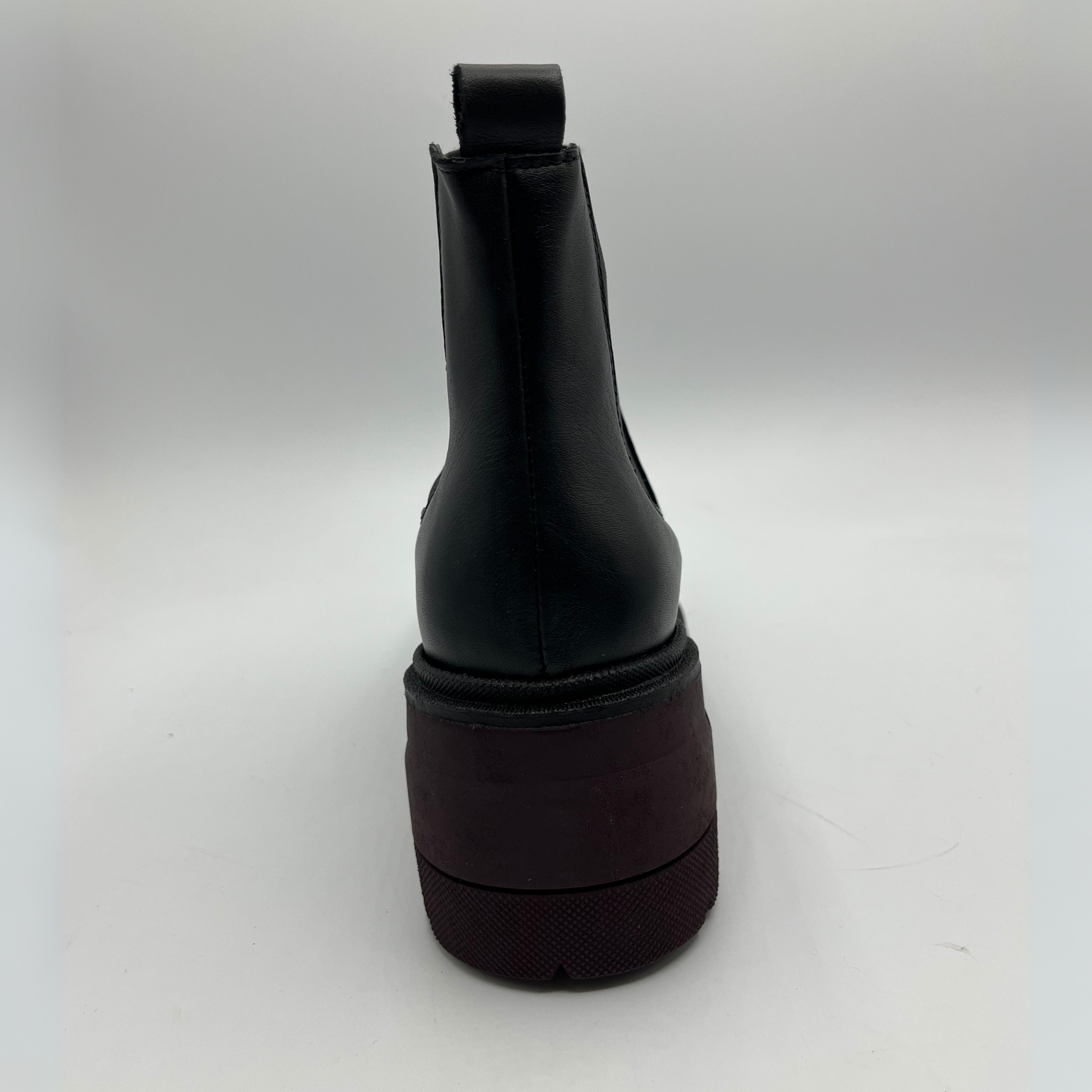 Black rubber boot on a white background