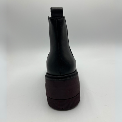 Black rubber boot on a white background