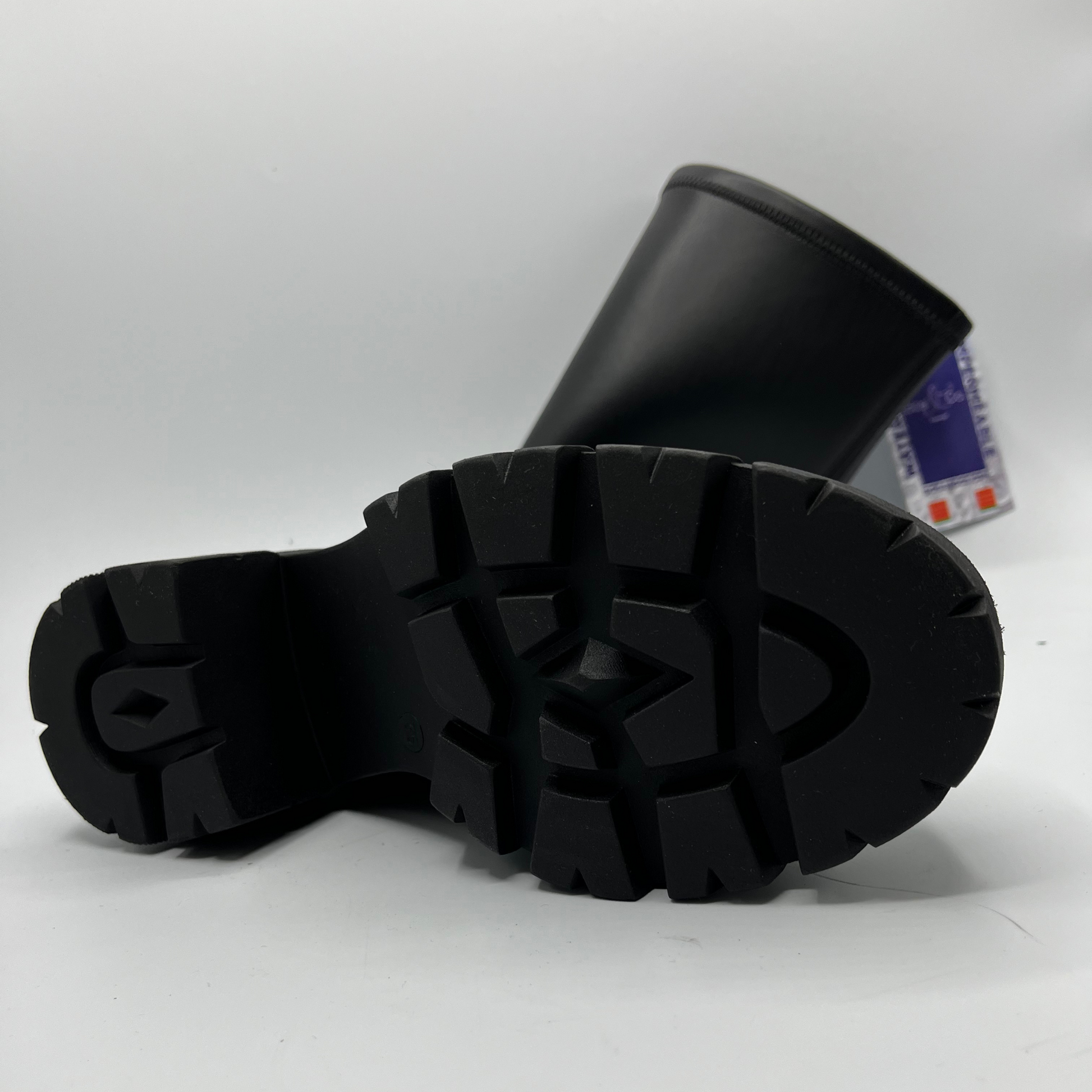 Black rubber boot sole on a white background