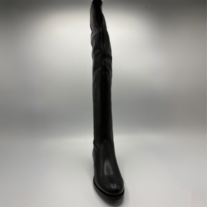 Front view of a black leather boot with an elasticated back panel on a white background