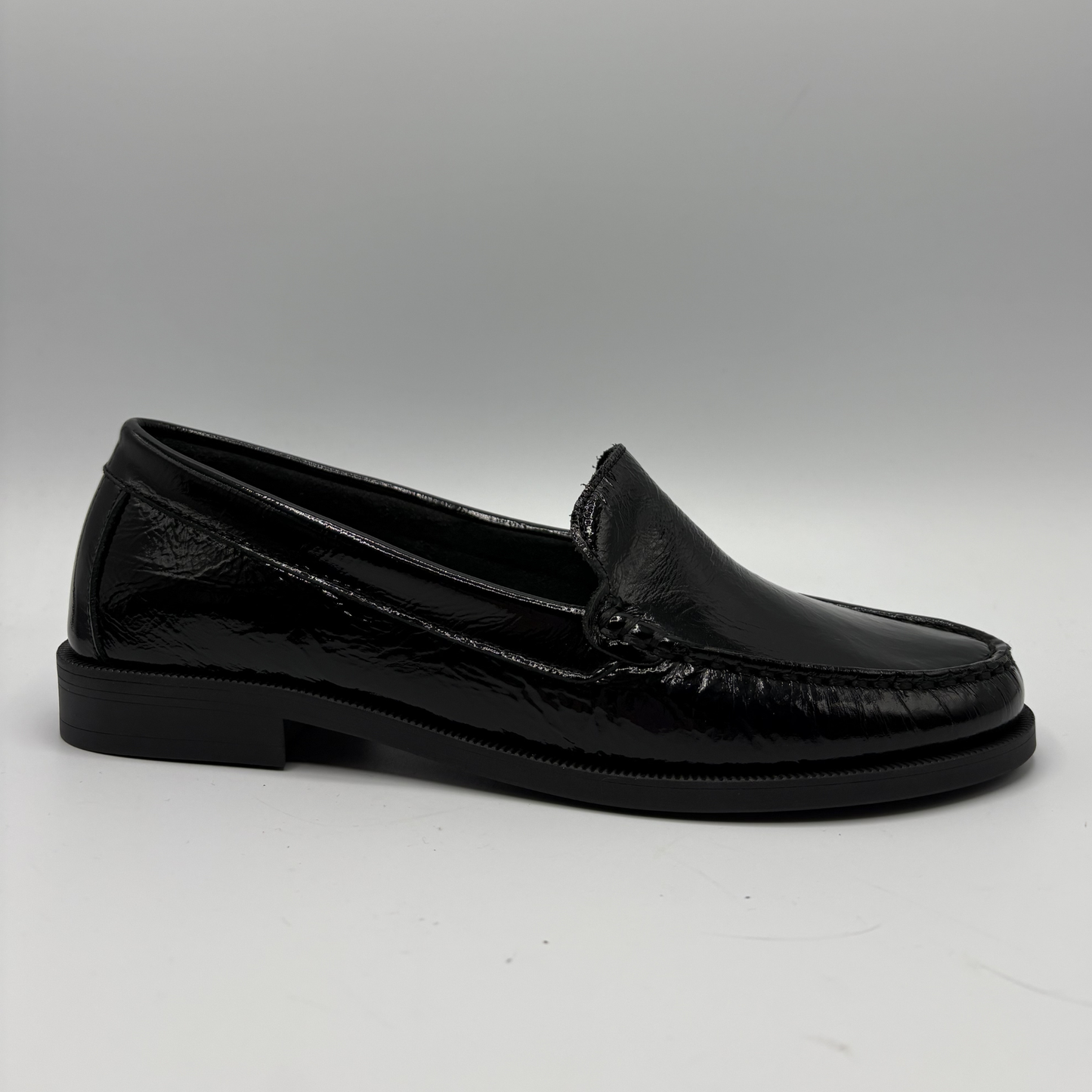 Black loafer shoe on a white background
