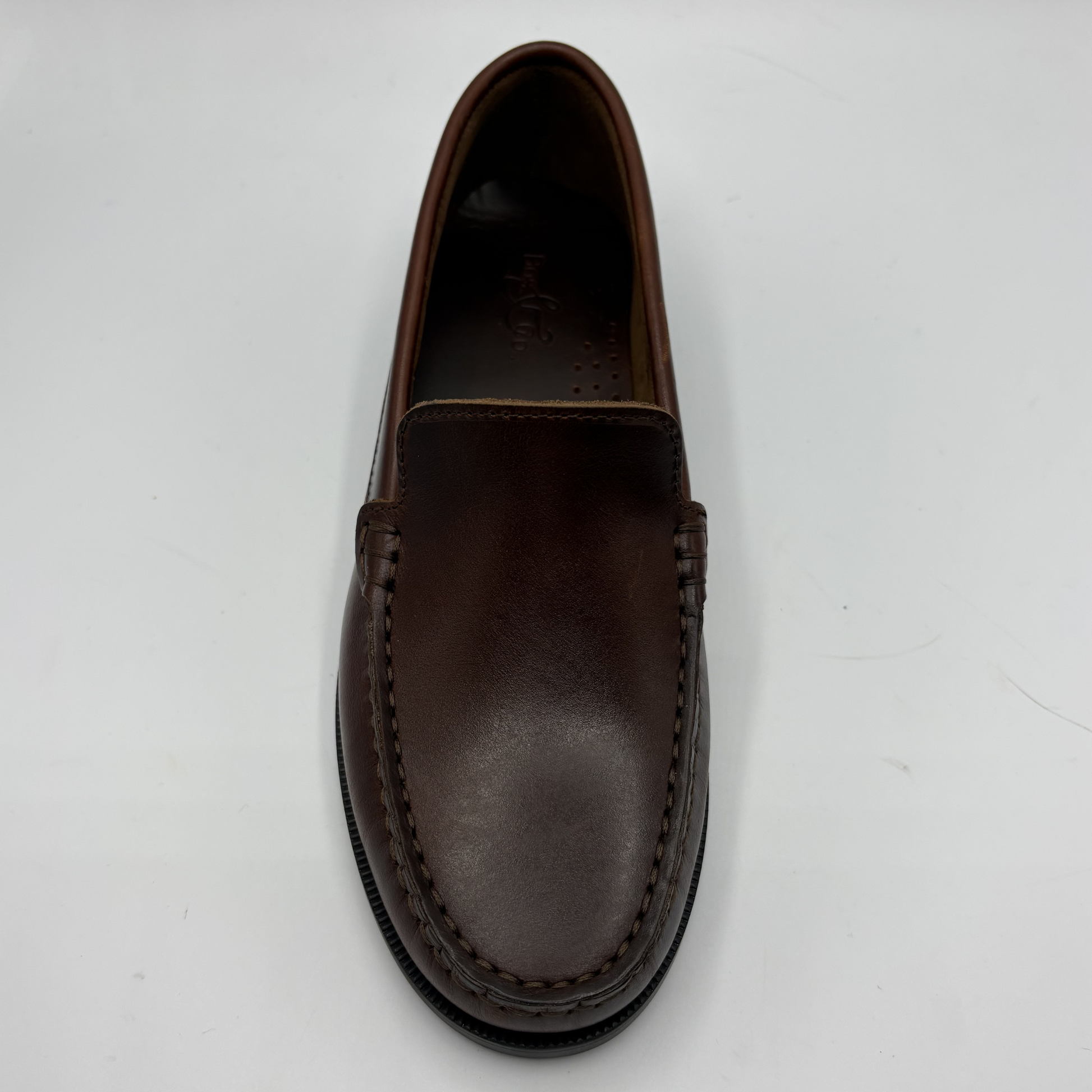 Brown leather loafer shoe on a white background