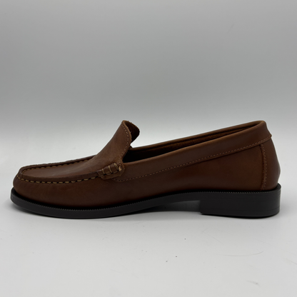 Brown loafer shoe on a white background
