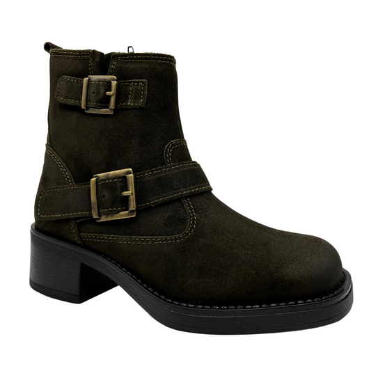 Angled view of olive colored suede short boot with two straps with brass buckles, side zipper closure and block heel.