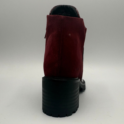 Back view of a short boot with a red croc front panel and a sturdy block heel