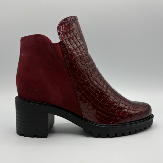 Right facing view of a short boot with a red croc front panel and a sturdy block heel