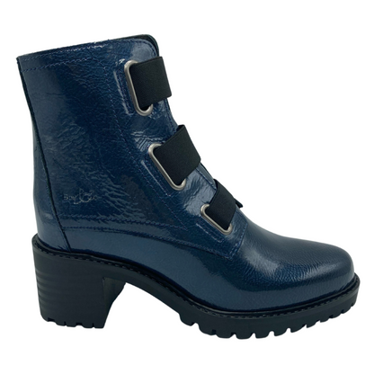 Right facing view of blue short patent leather boot with chunky black heel