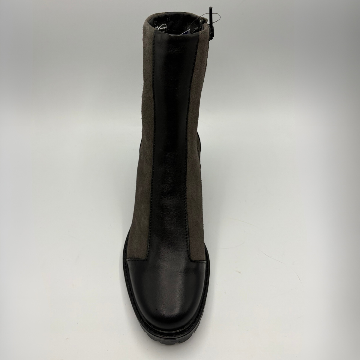 Top view of a two toned black short boot with a stacked heel and rounded toe