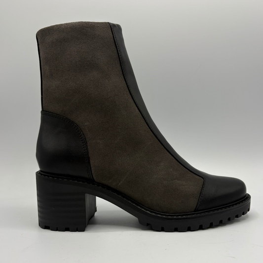 Right facing view of a two toned black short boot with a stacked heel and rounded toe