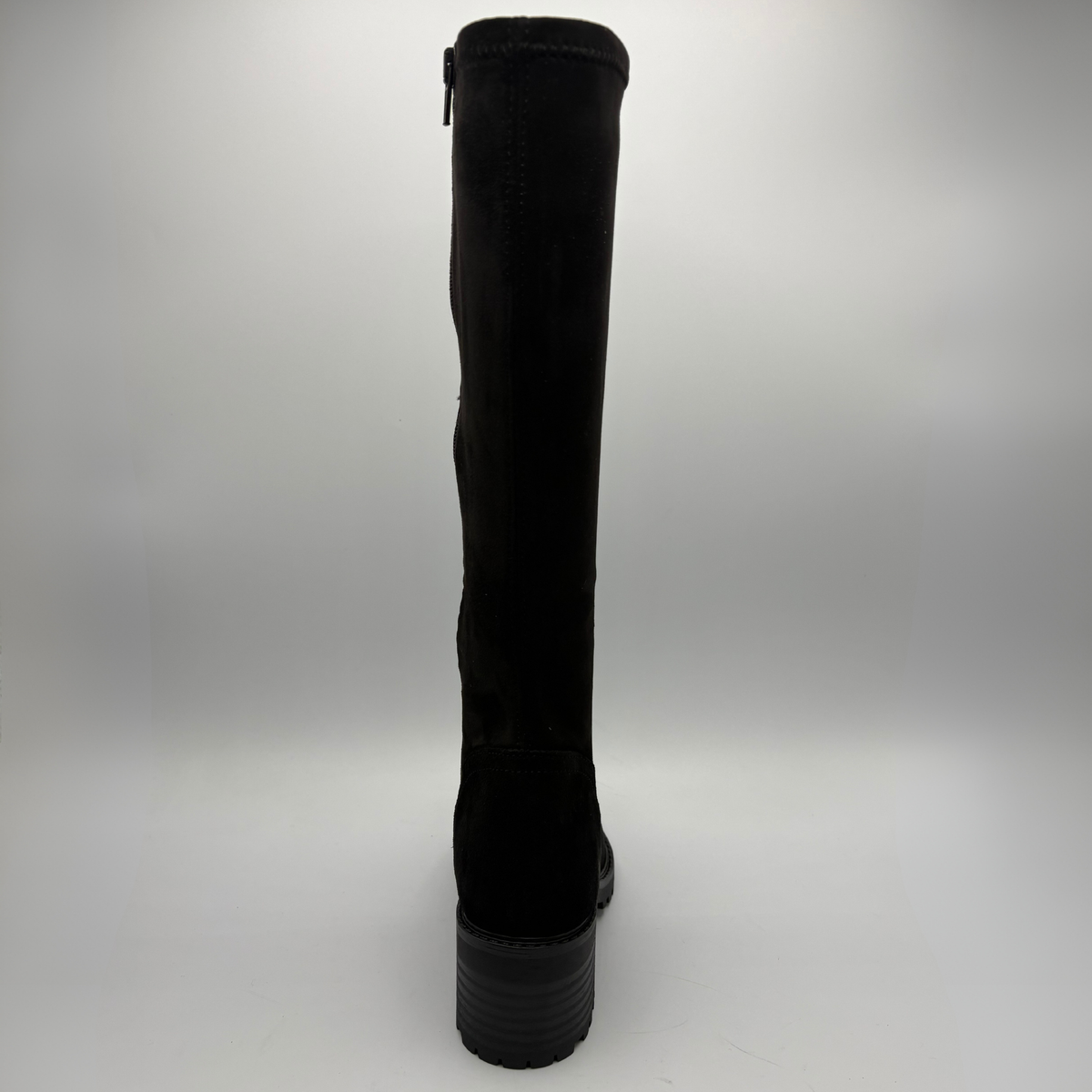 Back view of a black tall boot with a stacked heel