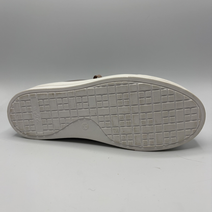 White shoe sole on a gray background