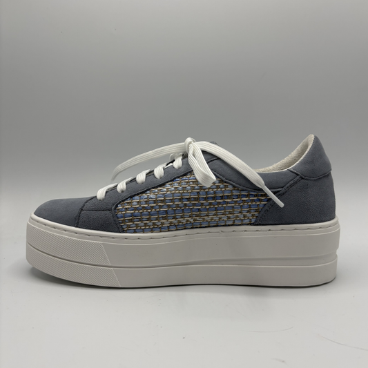 Gray sneaker with white sole on a gray background