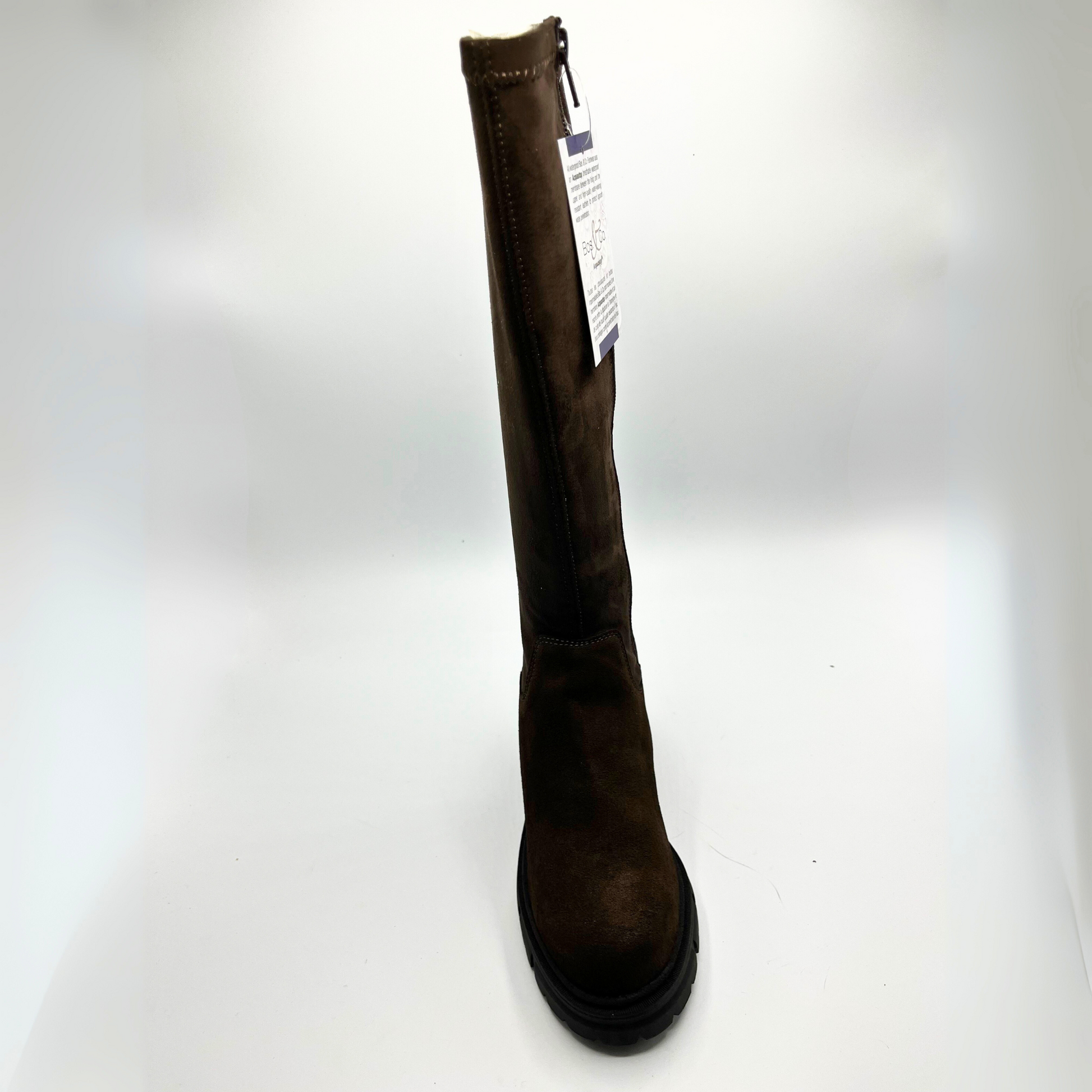 Brown knee-high boot with a visible brand tag on a white background