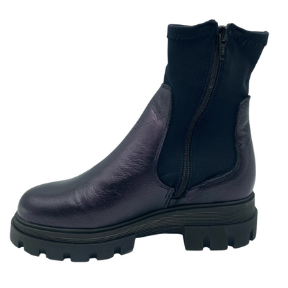 Left facing view of dark purple leather short boot with elastic upper and side zipper