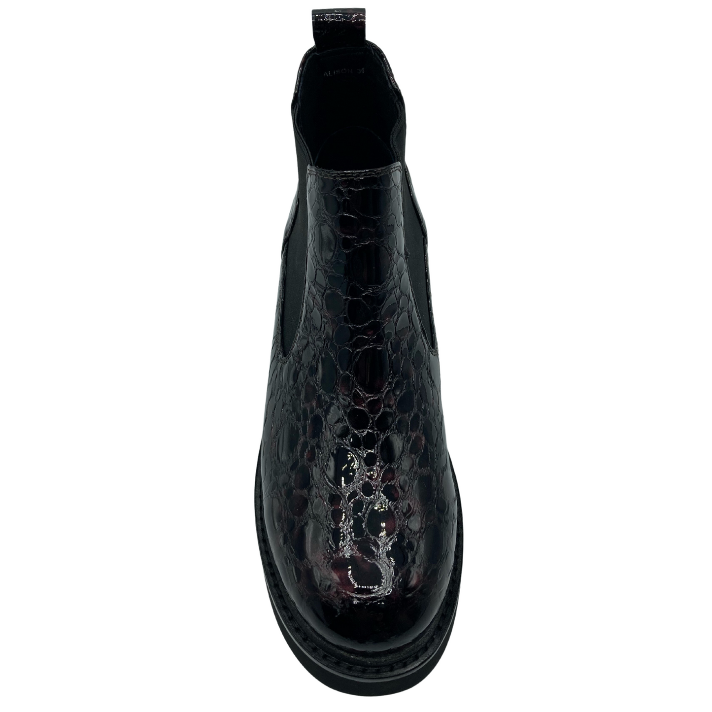 Top view of rounded toe leather boot with textured pattern and double elastic gore