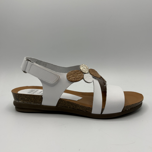 White sandal with brown accents on a gray background