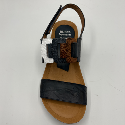 Sandal with multiple straps on a white background