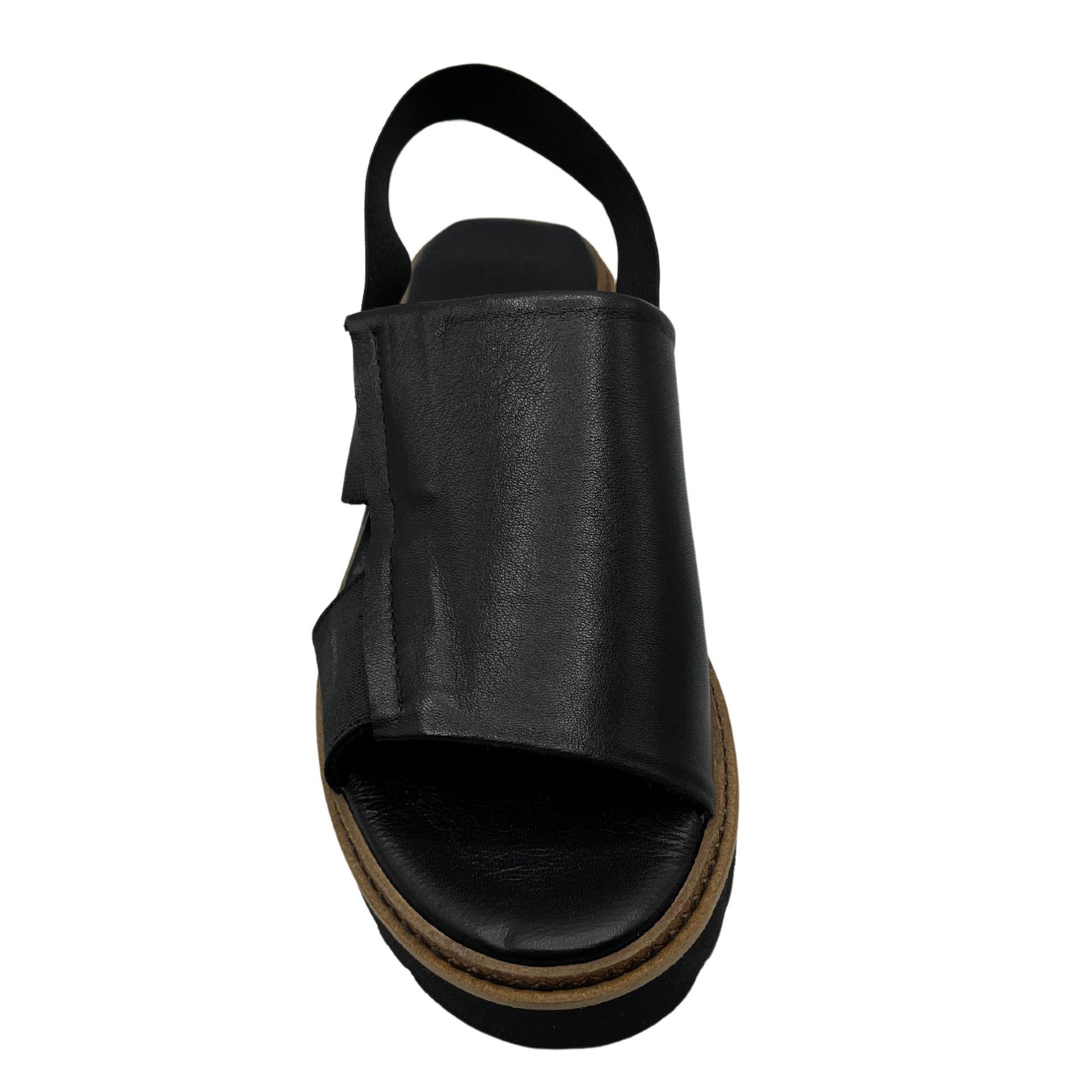 Top down view of black slip on sandal with elastic strap and rounded toe