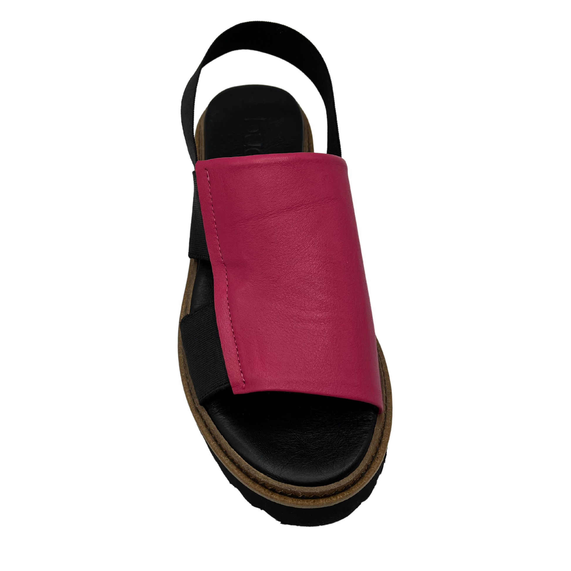 Top view of hot pink sandal with black elastic straps and rounded toe