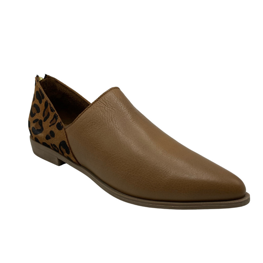 Angled view of brown flat with black and brown leather heel