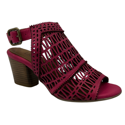 45 degree angled view of hot pink sandal with block heel and peep toe