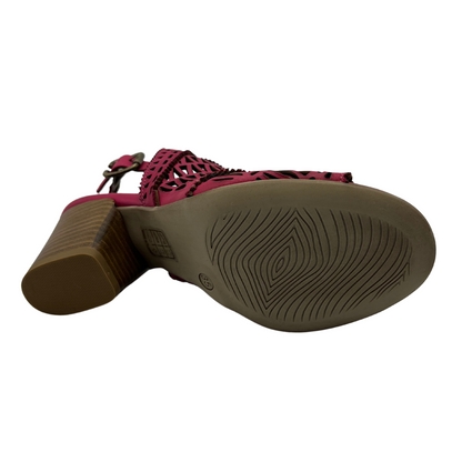 Bottom view of hot pink leather sandal with cutout details, stacked heel and rounded toe