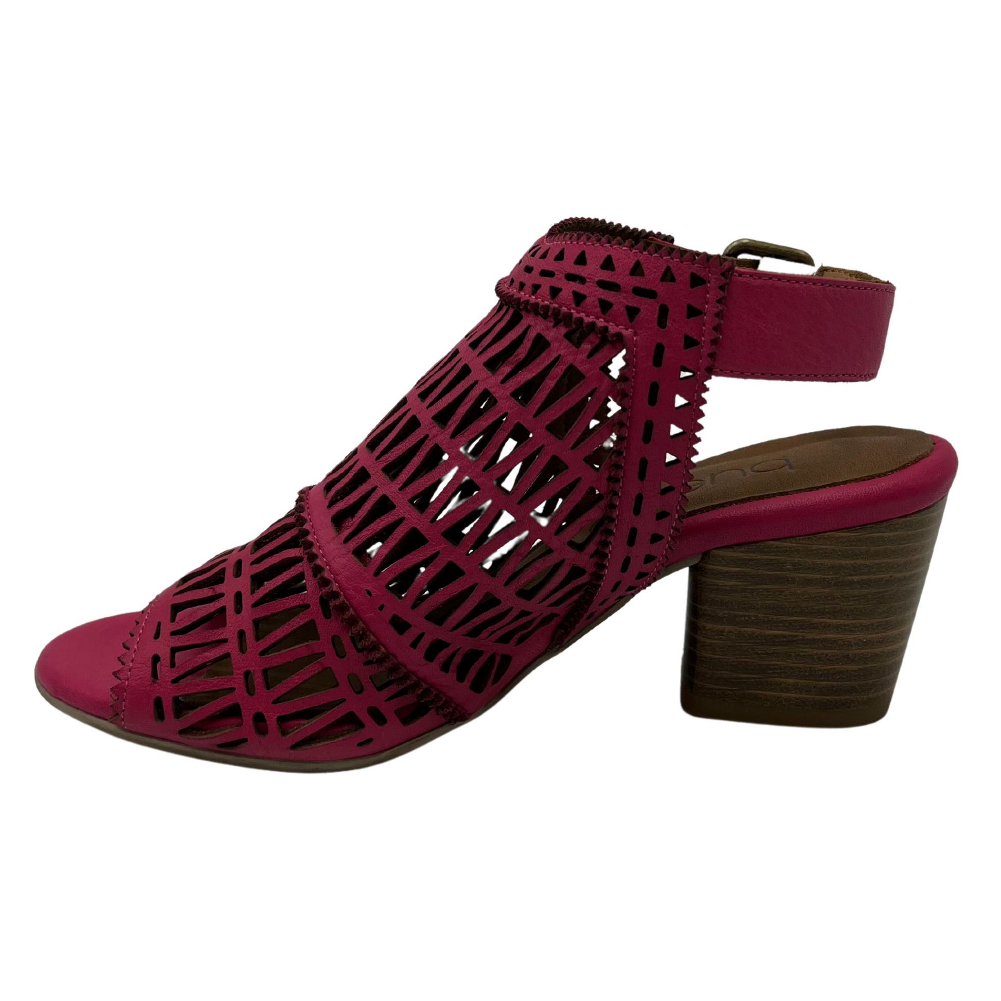 Left facing view of hot pink sandal with block heel, cut out details and peep toe