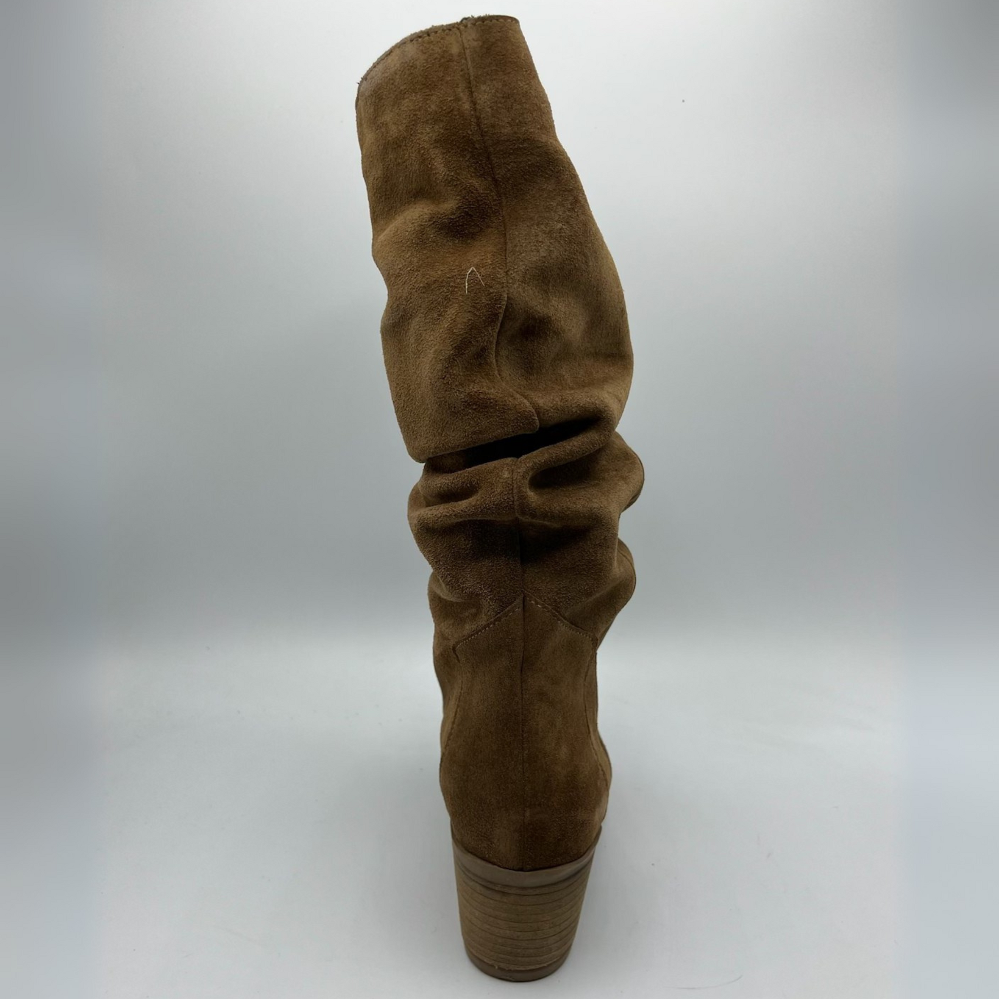 Brown suede boot on a white background