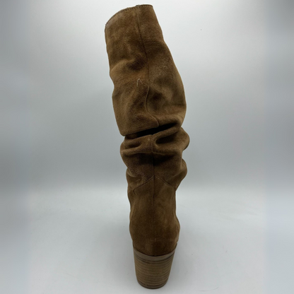 Brown suede boot on a white background