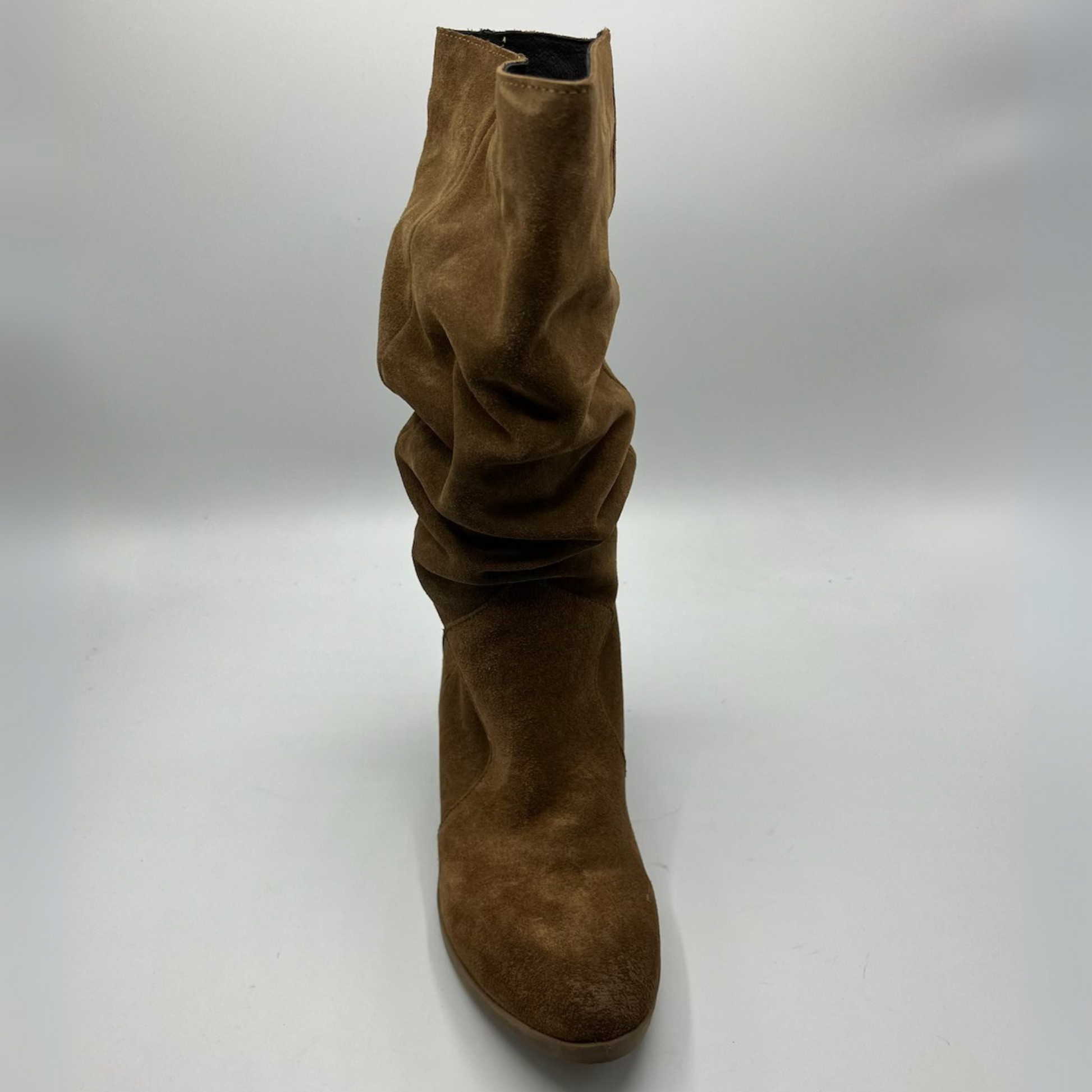 Brown suede boot on a white background